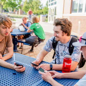 Students Outside at Table