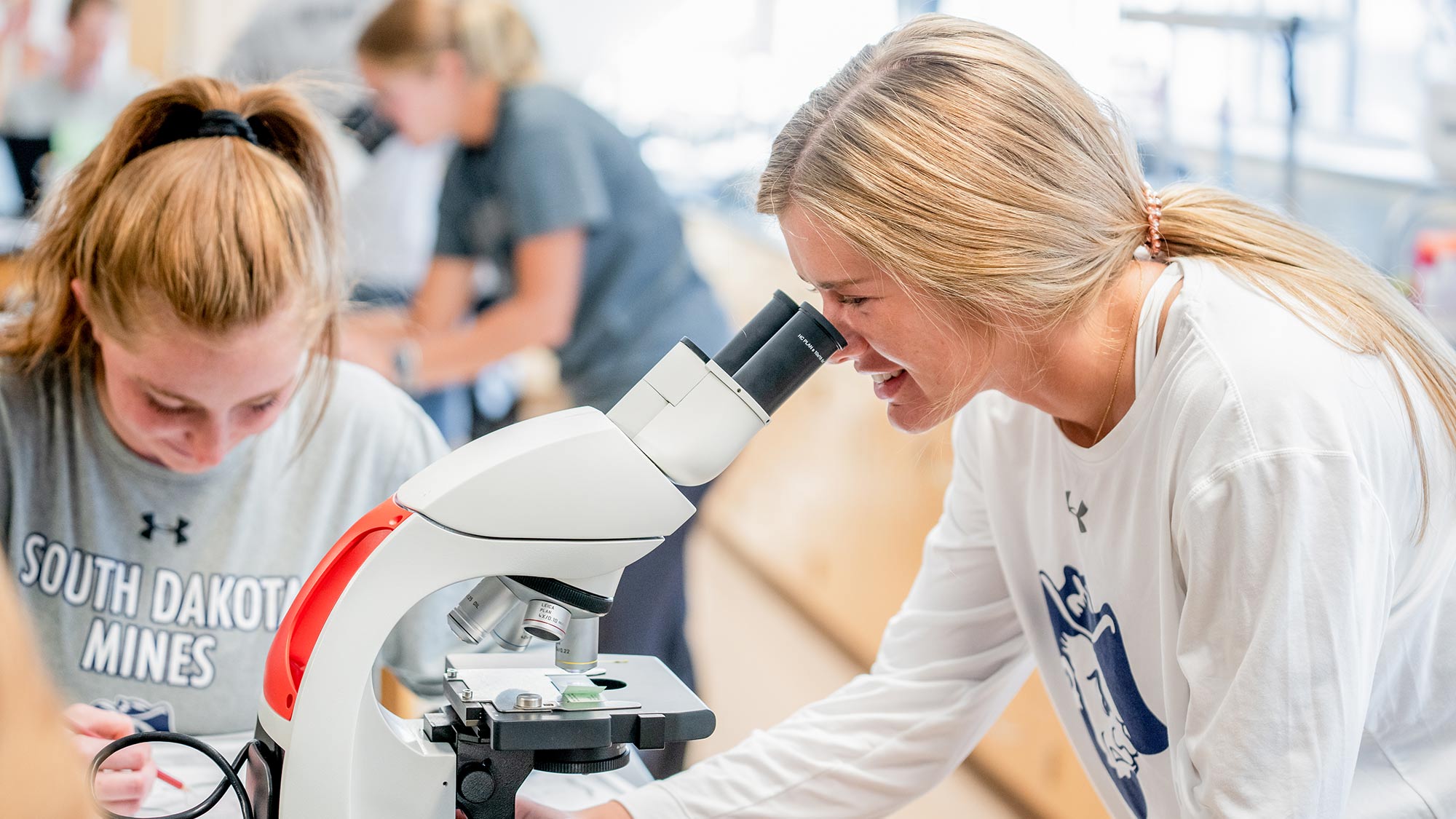 Student Using Microscope