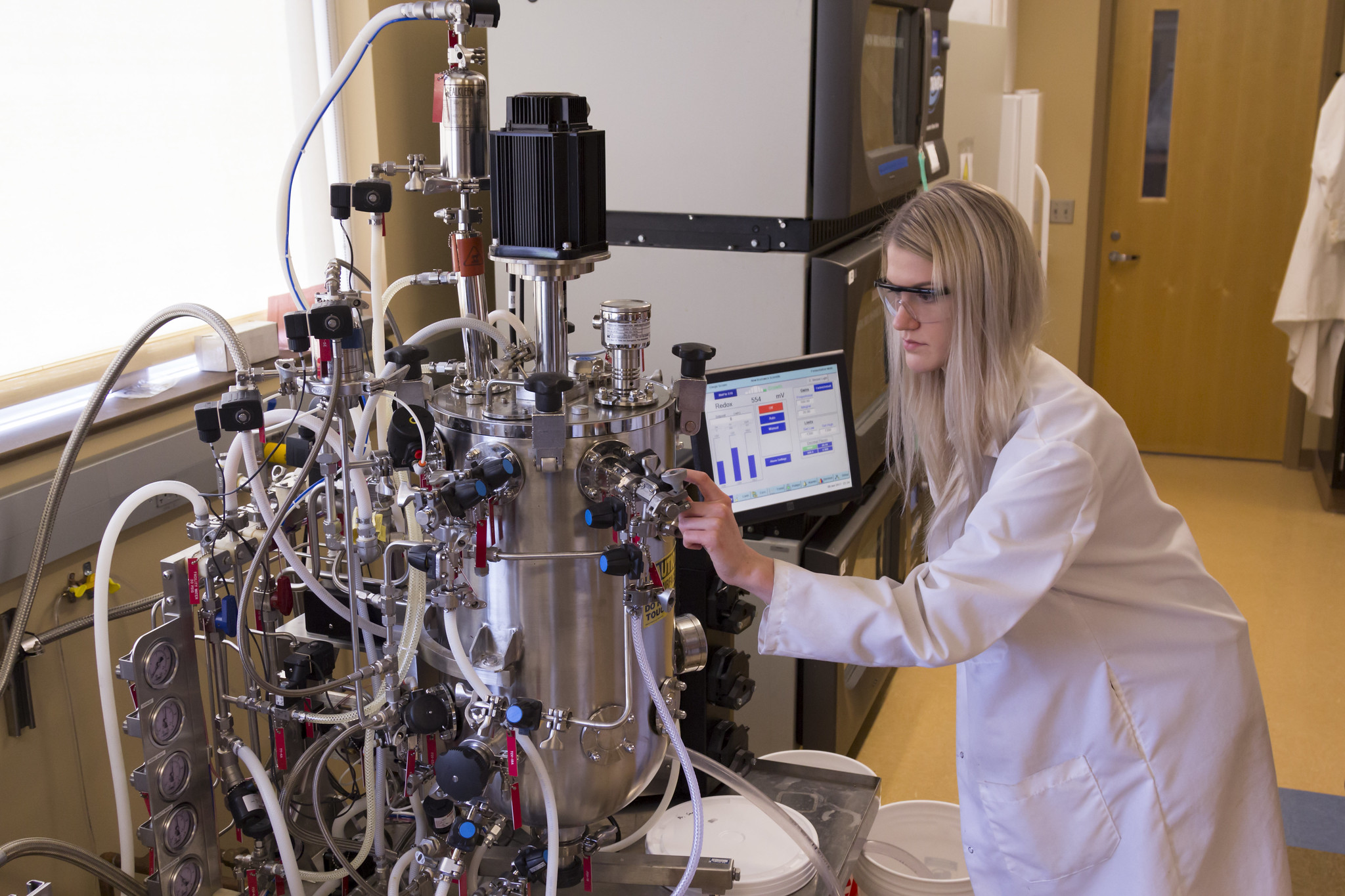 Researcher working with a specialized laboratory equipment.
