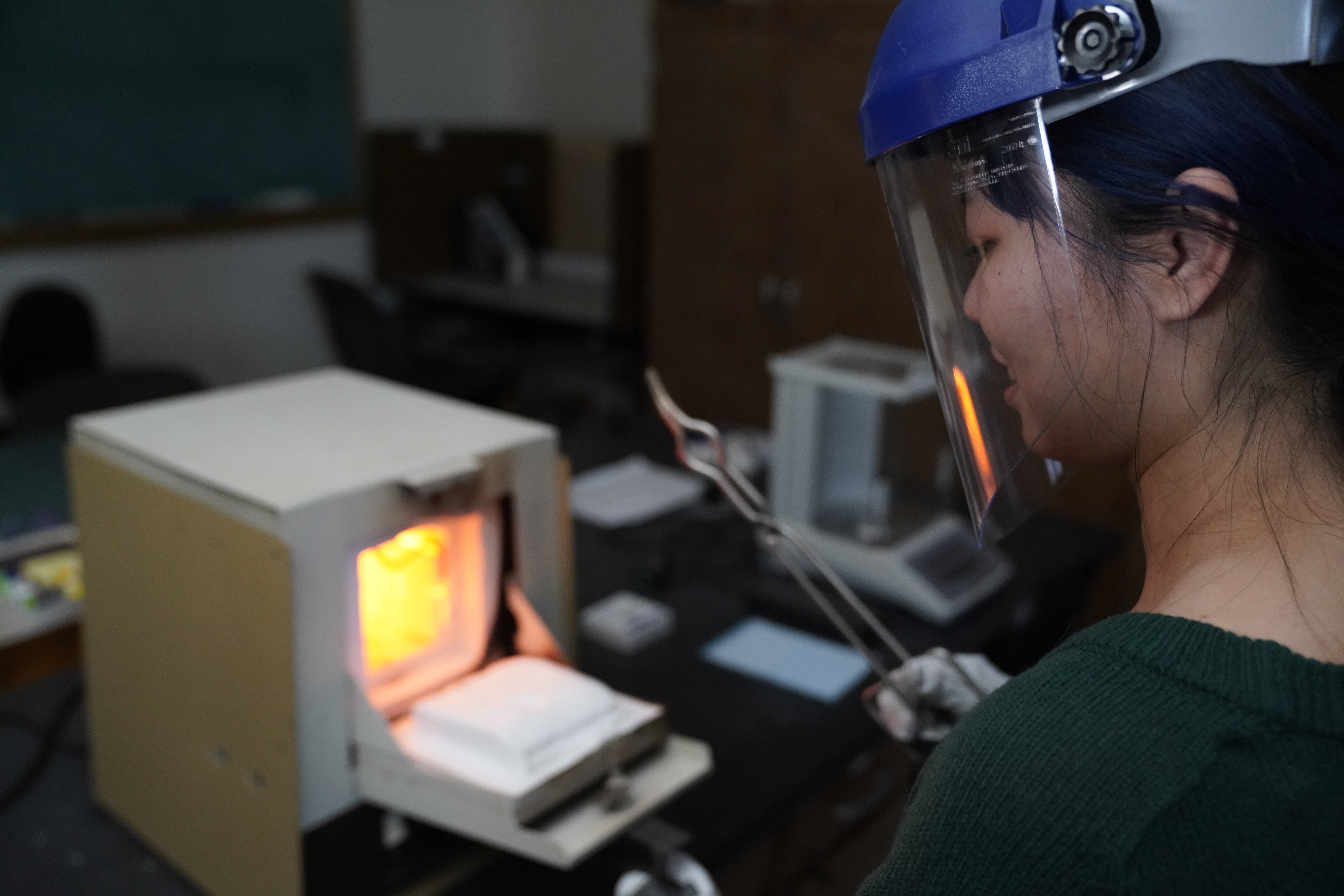 Lab work involving high-teperature processing with protective equipment.