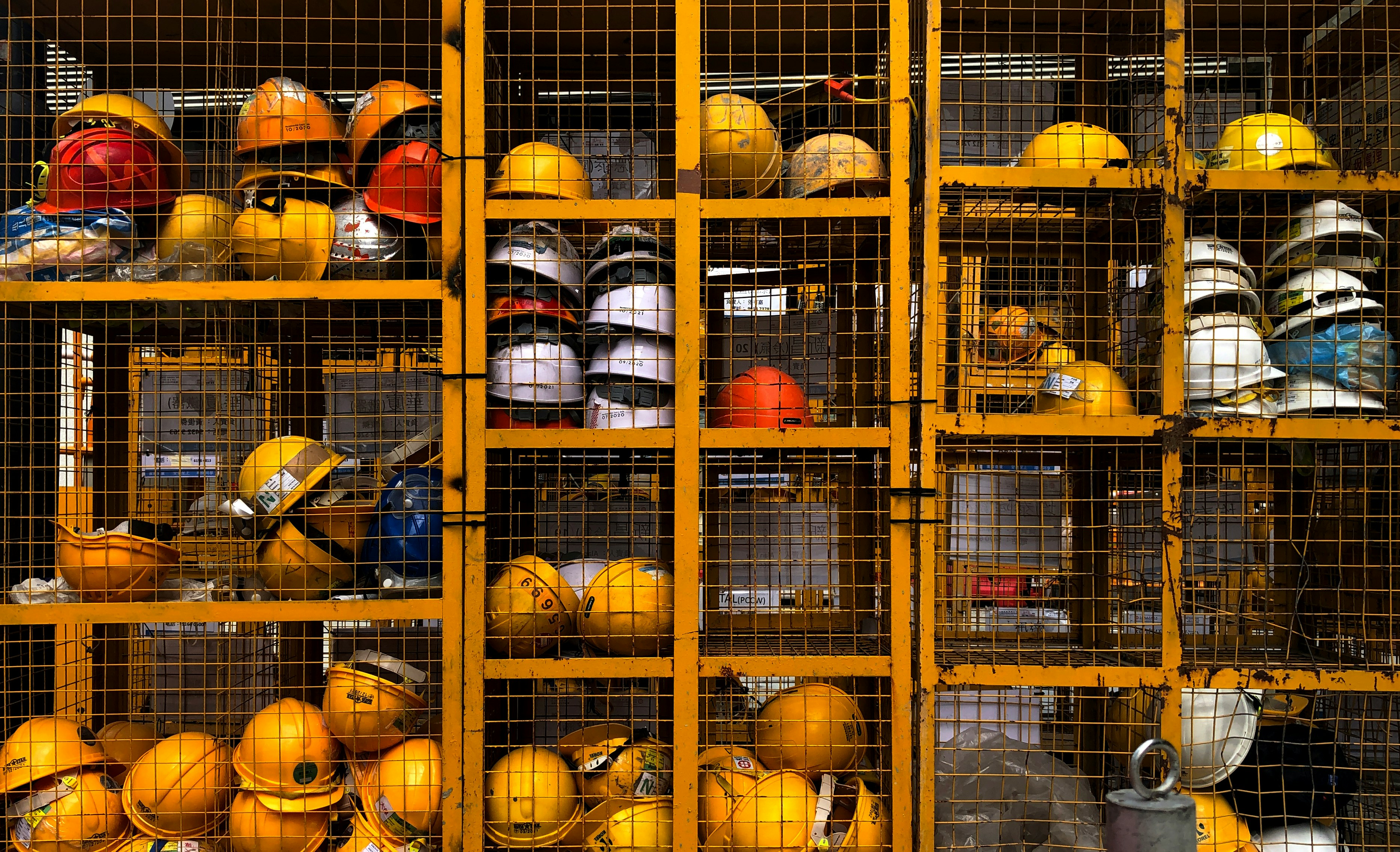 Shelves filled with safety helmets.