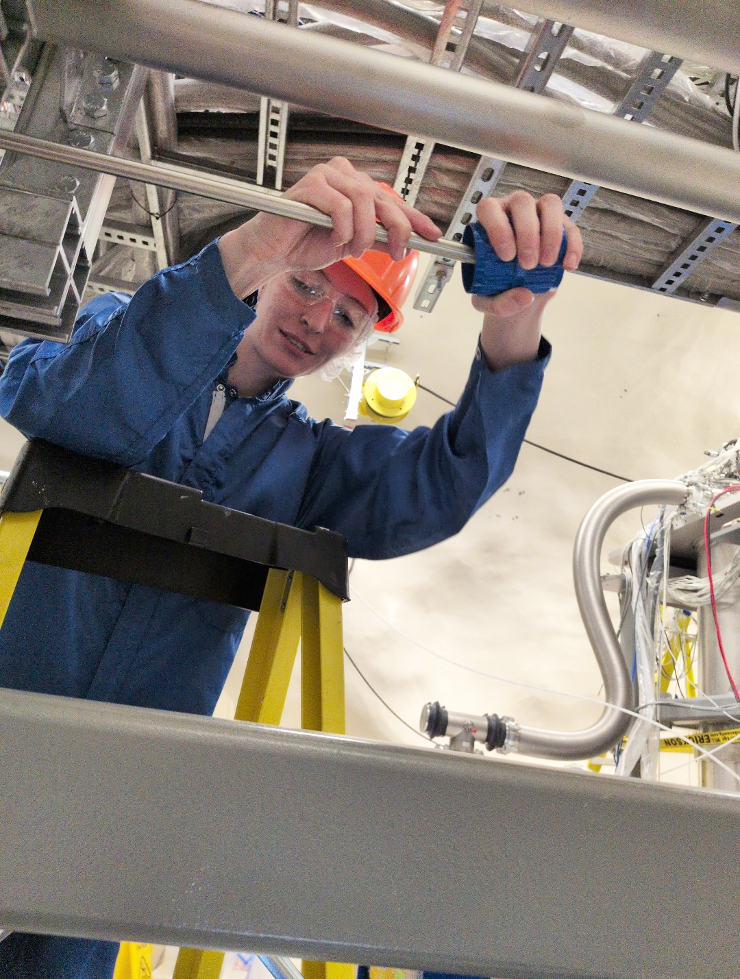 Nevena Cail, a physics graduate student at South Dakota Mines, helps install the team’s Radon Purge System at SNOLAB for the Super Cryogenic Dark Matter Search. 