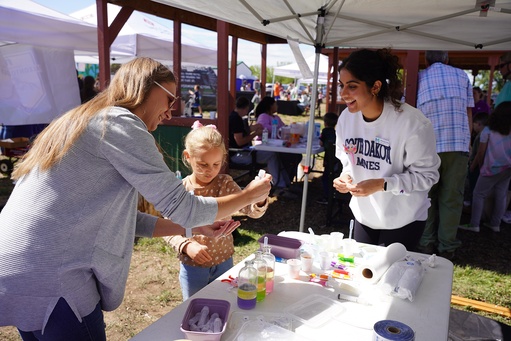 South Dakota Mines students brought science to life for children and families at the recent Youth and Family Services Harvest Festival at Fullerton Farm, offering hands-on activities and specimens that explored engineering, microbiology and paleontology.