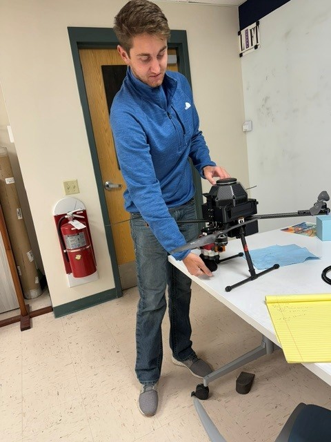 Zach Karg, a mechanical engineering doctoral student at South Dakota Mines, discusses the use of a custom-made drone in research work they are doing as part of the National Science Foundation-funded Advancement of Microbial Technologies for Sustainable Agriculture (AMiTSA), a multidisciplinary and institutional collaboration led by South Dakota State University (SDSU) that explores microbial-based fertilizers as an alternative to traditional synthetic fertilizers.