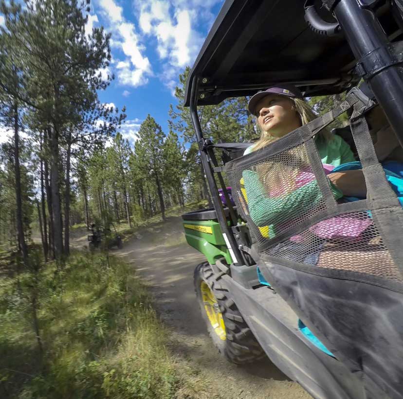 South Dakota Mines SD Girl Four Wheeling in Black Hills Forest