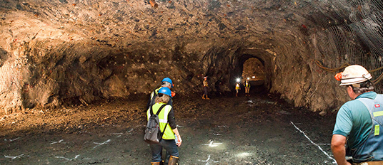 People working in a mining area underground