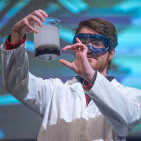 Chemist Showing Chemical Reaction