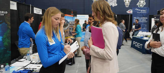 Student With Employer At Career Fair